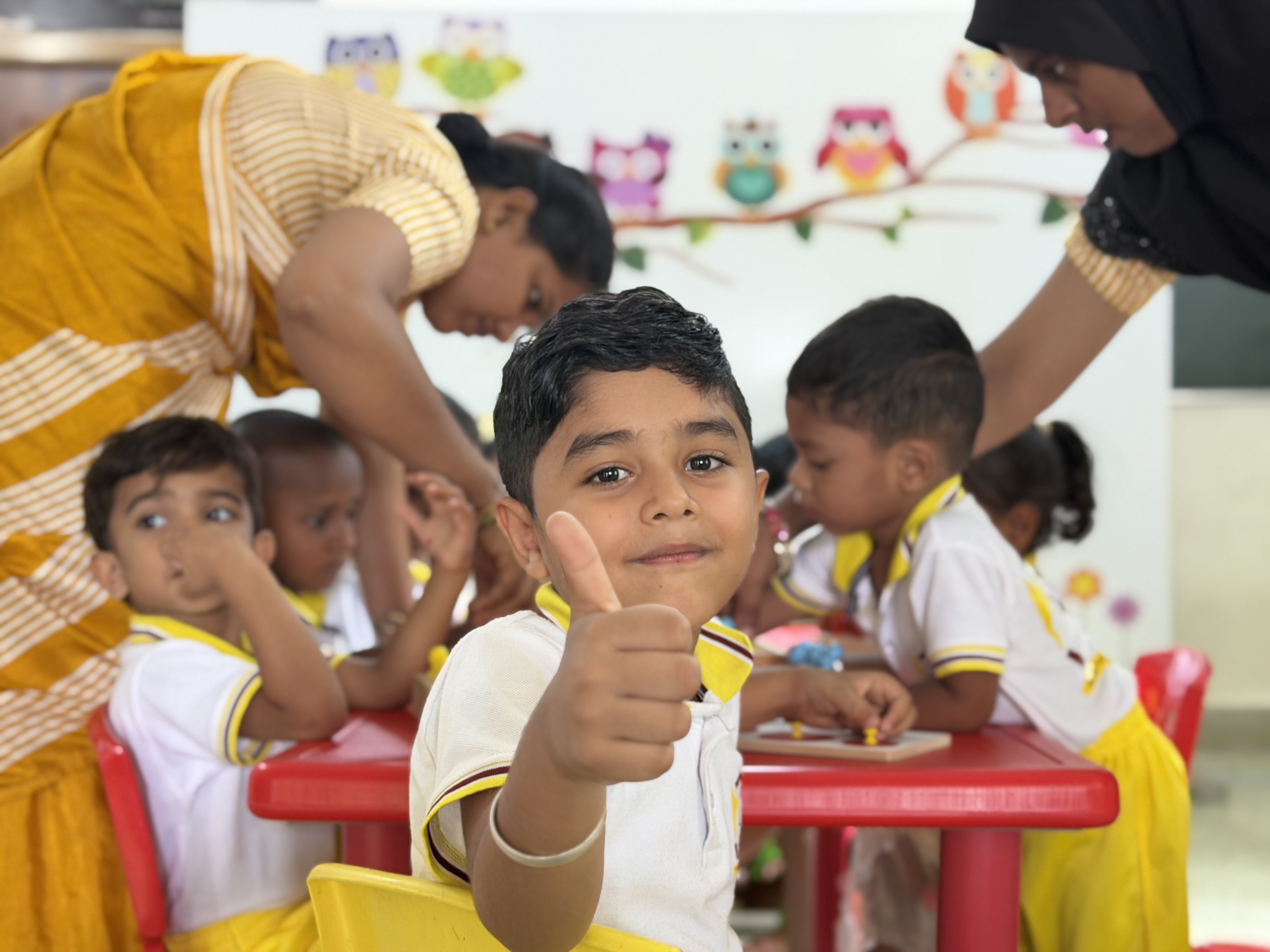 Happy preschool children in a Montessori classroom
