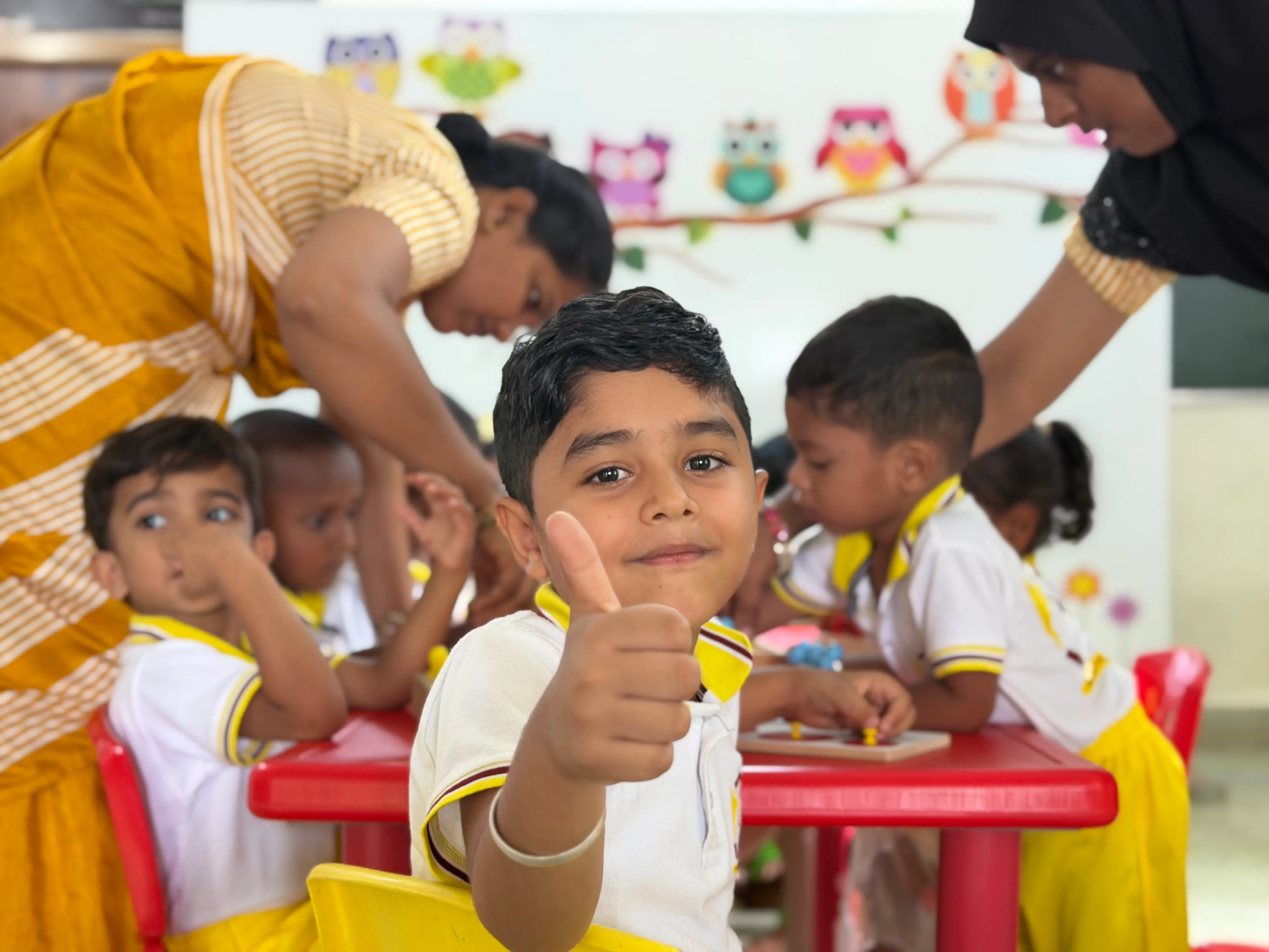 Happy preschool children in a Montessori classroom